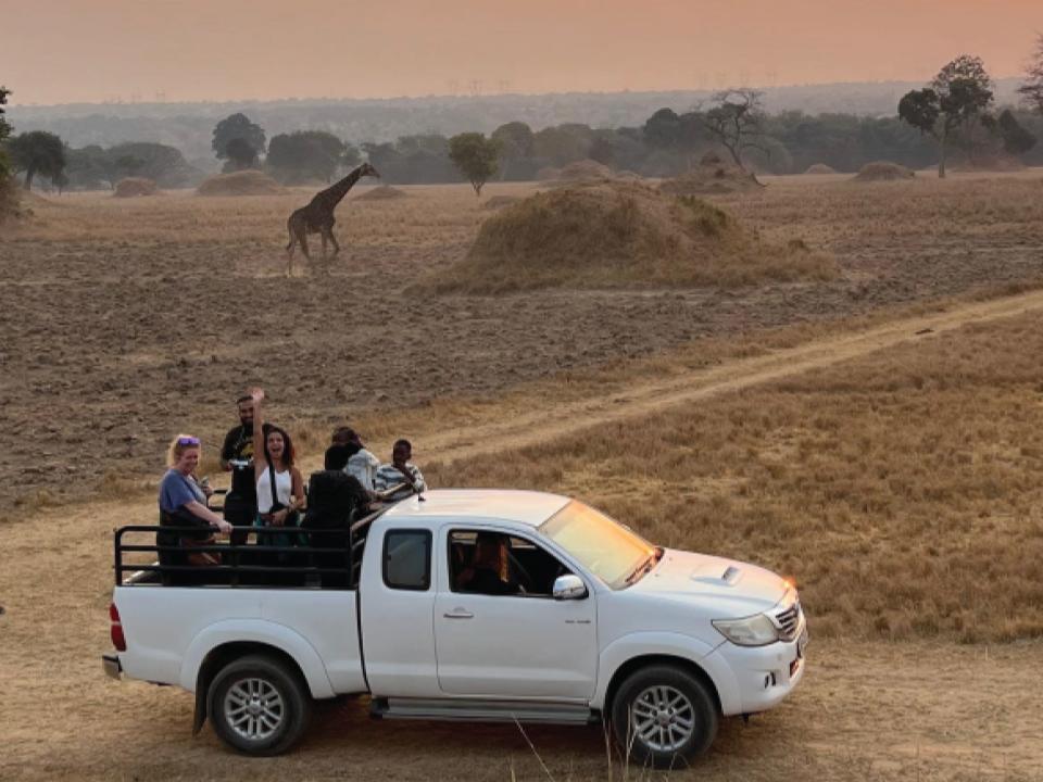 Students in pickup truck on safari