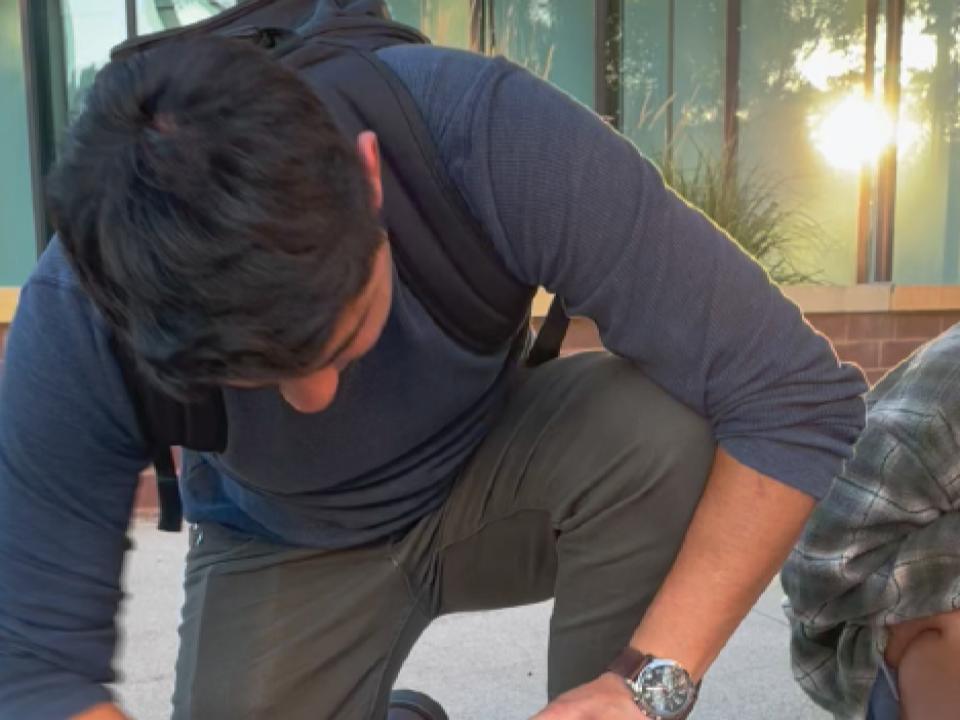 Student crouching.