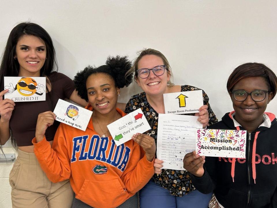 Students holding cards.